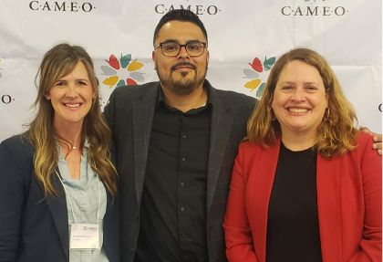 Three CAMEO members pose together at an event.