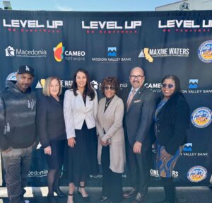 From left, Ron Gibson, Tamara Gurney, Carolina Martinez, Maxine Waters, Alejandro Guerrero and Tara Lynn Gray